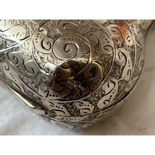 812 - Hallmarked silver purse George Unite London 1889 and a jug raised on three feet Birmingham 1915, mak... 