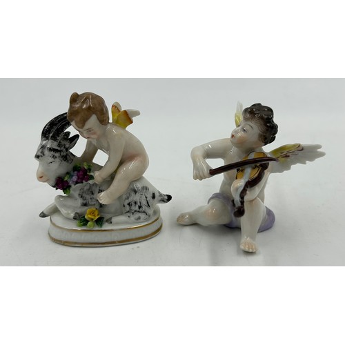 229 - A selection of 20th Century European Porcelain figurines to include a pair of Three Volkstedt Cherub... 