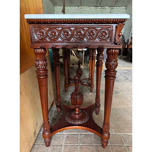 67 - A reproduction marble topped side table.