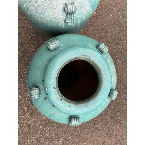 19 - A pair of ceramic turquoise garden urns. 69cm h.