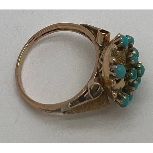 689 - A 14 carat gold ring set with turquoise. Size Q. Weight 4.3gm.