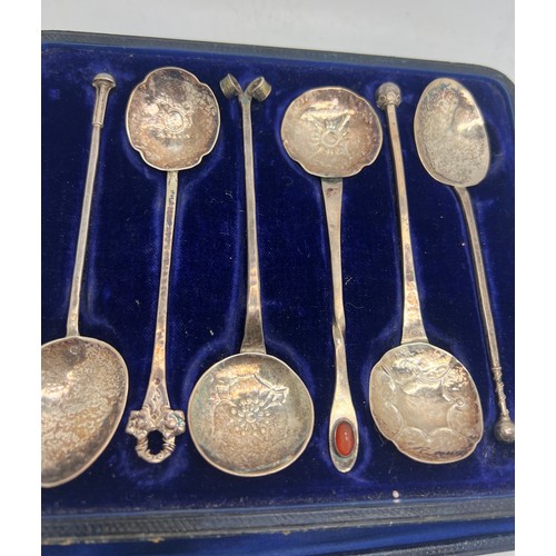 761 - A boxed set of six individual Arts and Crafts unmarked white metal spoons with planished bowls. Tota... 