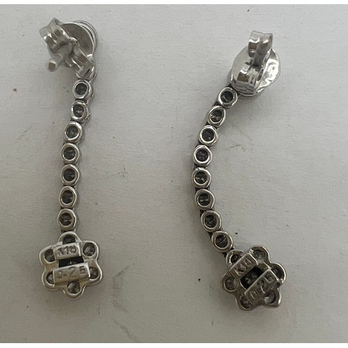 684 - A pair of 18 carat white gold and diamond drop earrings. Weight 2.5gm. Length 2.5cm.