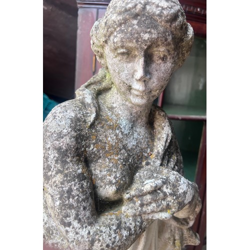 21 - A reconstituted stone figure of a woman 90cm h.