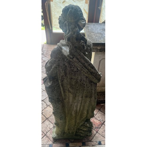 21 - A reconstituted stone figure of a woman 90cm h.