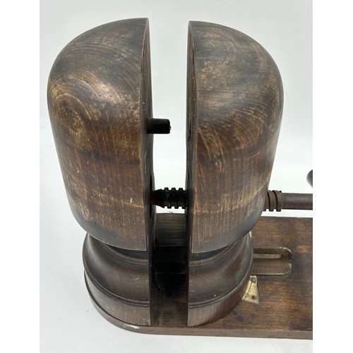 887 - A late 19thC wooden hat stretcher with metal turning handle and measurement plate, approx. 33cm h, t... 