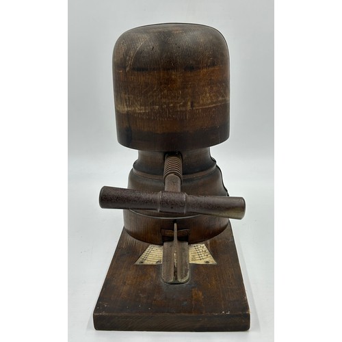 887 - A late 19thC wooden hat stretcher with metal turning handle and measurement plate, approx. 33cm h, t... 