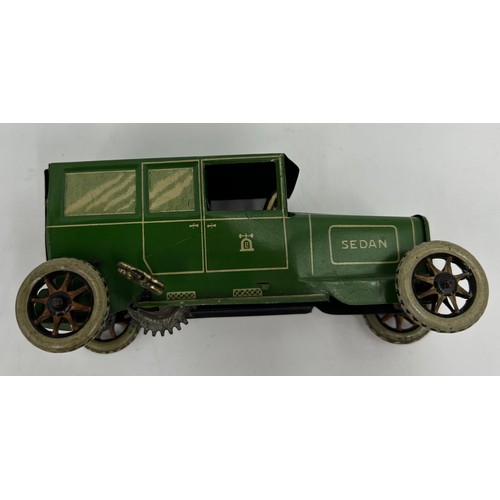 1151 - Two Lehmann No.765 Sedans, tinplate and clockwork models finished in green and cream with single fix... 