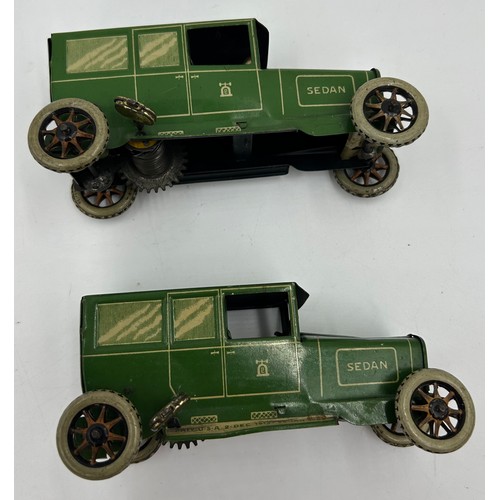 1151 - Two Lehmann No.765 Sedans, tinplate and clockwork models finished in green and cream with single fix... 