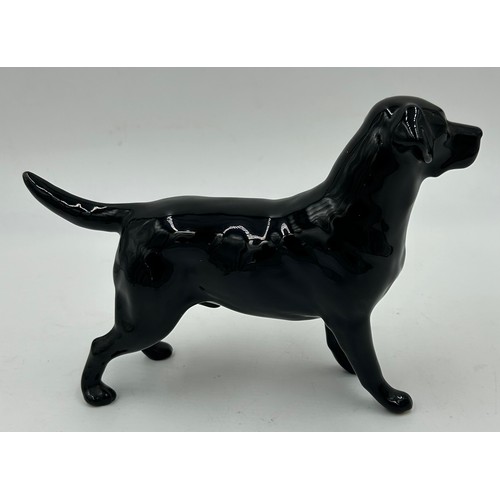 222 - Beswick - a black Labrador, a Spaniel 'CH Horseshoe Primula' 13cm h, and a matt Spaniel, a Black fac... 