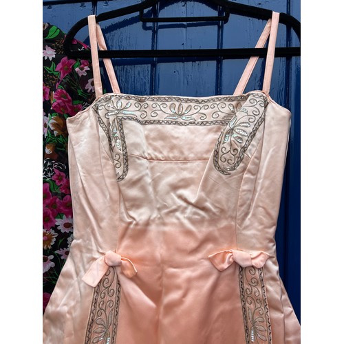 885 - 1950/60’s costume to include peach embroidered dress, 2 full length dresses and a full length skirt.