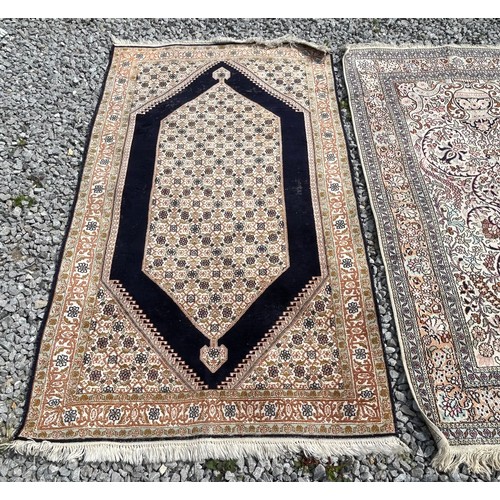 1220 - Two Kashmir silk rugs. Both approx. 160 x 92cm.