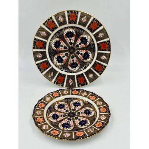 397 - Two Royal Crown Derby plates in Old Imari 1128 pattern. 27cm d and 23cm d.