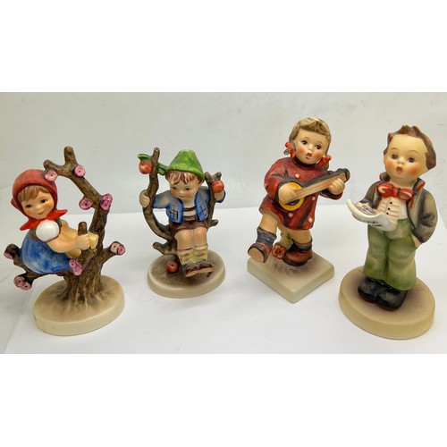 215 - Four Hummel Goebel figures to include Soloist, Happiness, Apple Tree Girl, with box and Boy in Apple... 