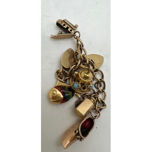 674 - A 9 carat gold charm bracelet and six charms, four unmarked. House and lamp marked 9 carat gold. Tot... 