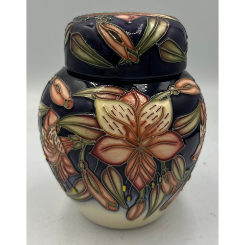 211 - A Moorcroft Peruvian Lily pattern ginger jar. 11cm h. In original box.