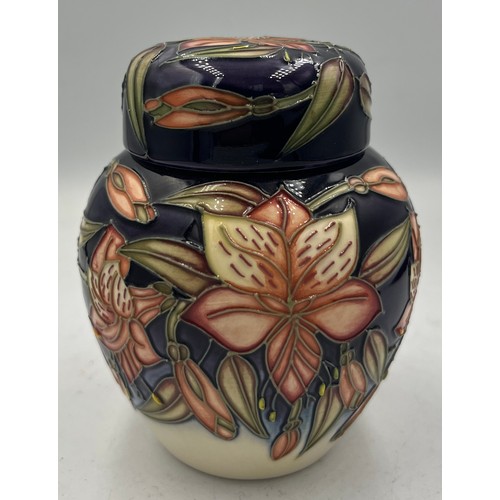 211 - A Moorcroft Peruvian Lily pattern ginger jar. 11cm h. In original box.