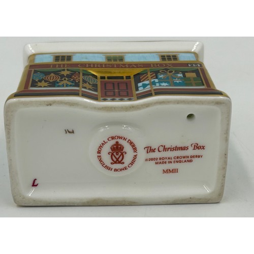 400 - A collection of Royal Crown Derby Cottages to include 'The Christmas Box' 'The China Shop' signed to... 