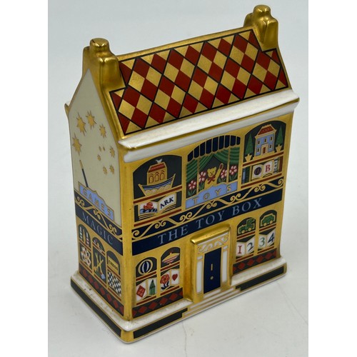 400 - A collection of Royal Crown Derby Cottages to include 'The Christmas Box' 'The China Shop' signed to... 