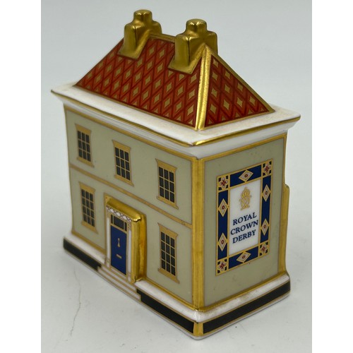 400 - A collection of Royal Crown Derby Cottages to include 'The Christmas Box' 'The China Shop' signed to... 