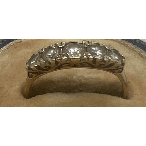 634 - A 9 carat gold ring set with CZ. Size O. Weight 1.9gm.