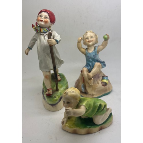 203 - Three Royal Worcester figures, F.G Doughty ‘Michael’, ‘Sunday’s Child’ and ‘Thursday’s Child’.