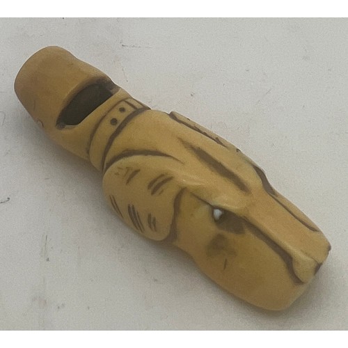 1297 - A 19thC carved bone dog whistle. 5.5cm l.