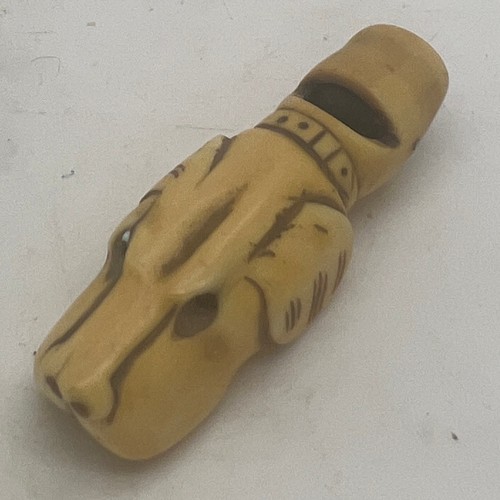 1297 - A 19thC carved bone dog whistle. 5.5cm l.