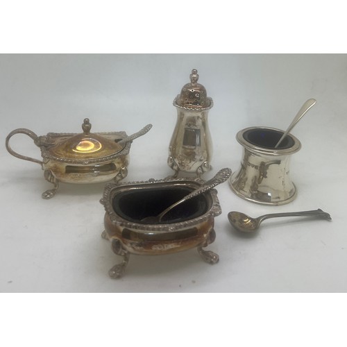 772 - A three piece silver cruet set comprising salt, pepper, mustard and two spoons plus a single salt an... 