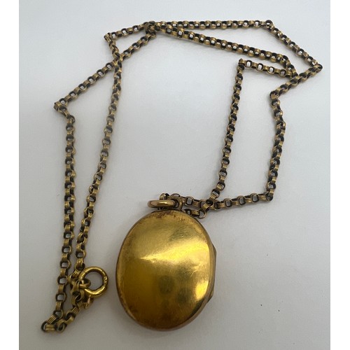 643 - A nine carat gold chain with unmarked yellow metal locket with crucifix set with turquoise stones. C... 