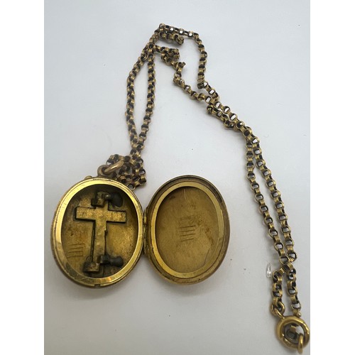 643 - A nine carat gold chain with unmarked yellow metal locket with crucifix set with turquoise stones. C... 