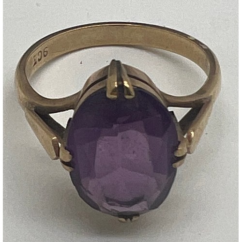 649 - Nine carat gold ring set with purple stone. Size Q. Weight 4gm.