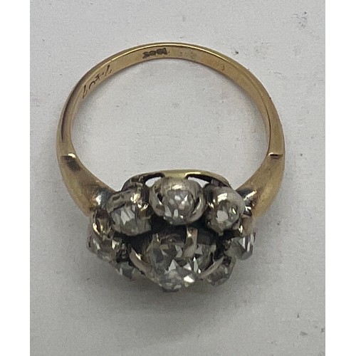 661 - A 19thC diamond set cluster ring in 18 carat yellow gold, comprising of a central four claw and grai... 