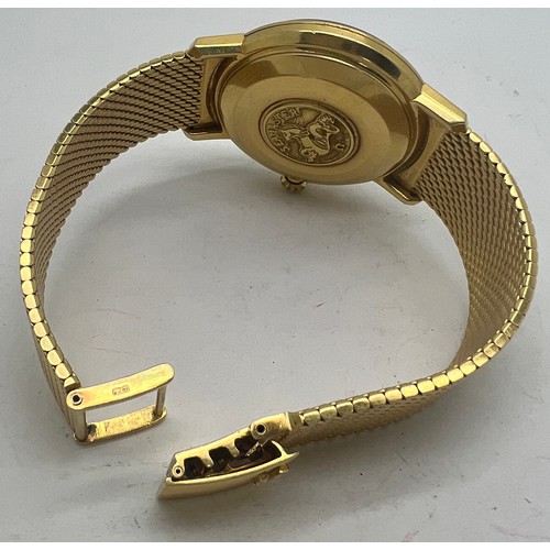 713 - An 18 carat gold gentleman’s Omega De Ville Seamaster wristwatch on 18ct gold bracelet with date ape... 