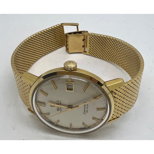 713 - An 18 carat gold gentleman’s Omega De Ville Seamaster wristwatch on 18ct gold bracelet with date ape... 