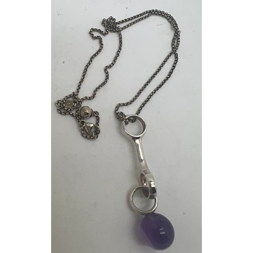 670 - A Georg Jensen sterling silver and amethyst pendant. Chain length 44cm.