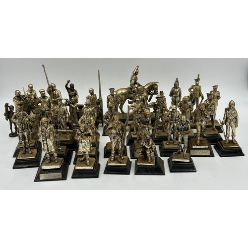 1300 - A collection of 29 Royal Hampshire Pewter military figures together with 14 other figures depicting ... 