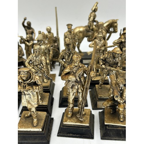 1300 - A collection of 29 Royal Hampshire Pewter military figures together with 14 other figures depicting ... 