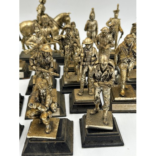 1300 - A collection of 29 Royal Hampshire Pewter military figures together with 14 other figures depicting ... 