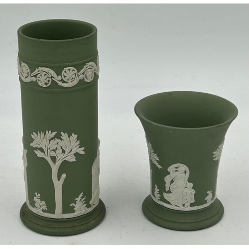 192 - A collection of Wedgwood green Jasperware to include lidded pot, various vases, a dark green twin ha... 