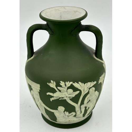 192 - A collection of Wedgwood green Jasperware to include lidded pot, various vases, a dark green twin ha... 