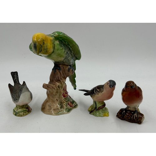 195 - A collection of ceramics to include a Beswick Girl on Skewbald Pony, model 1499, Beswick Parrot 930,... 