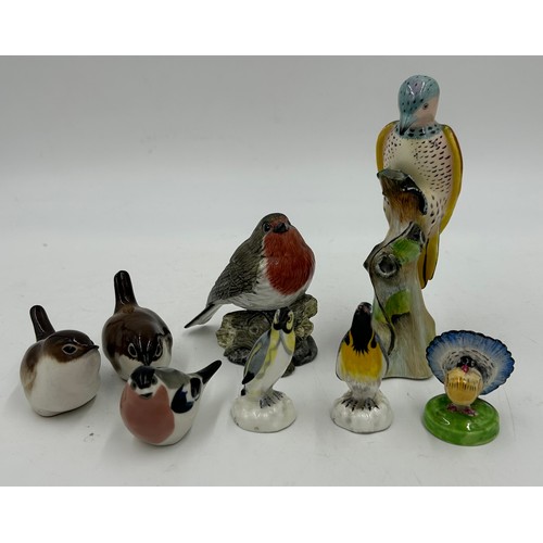 195 - A collection of ceramics to include a Beswick Girl on Skewbald Pony, model 1499, Beswick Parrot 930,... 