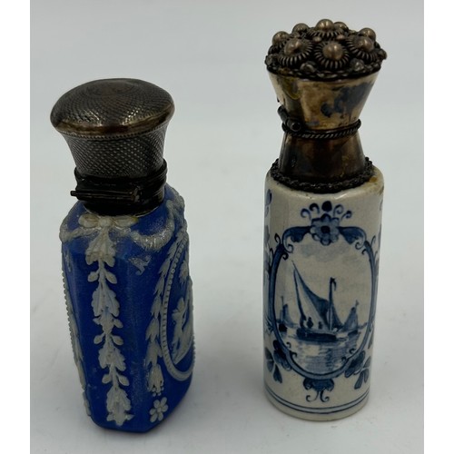 185 - Two blue and white perfume bottles with metal tops, one Delft 8cm h.