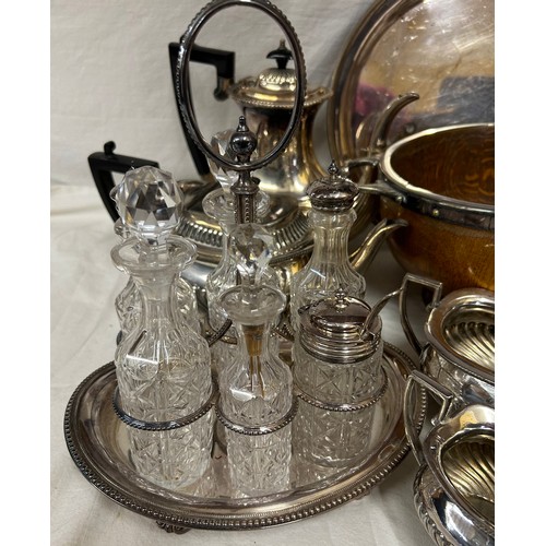 748 - A quantity of silver plated items to include a pair of candlesticks, 2 x coffee pots, teapot, sugar,... 