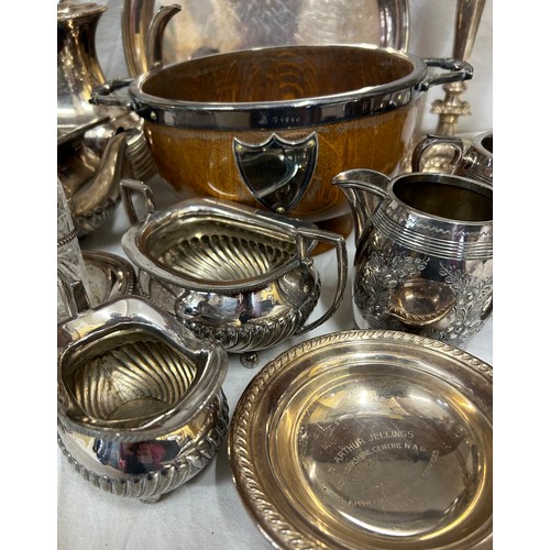 748 - A quantity of silver plated items to include a pair of candlesticks, 2 x coffee pots, teapot, sugar,... 