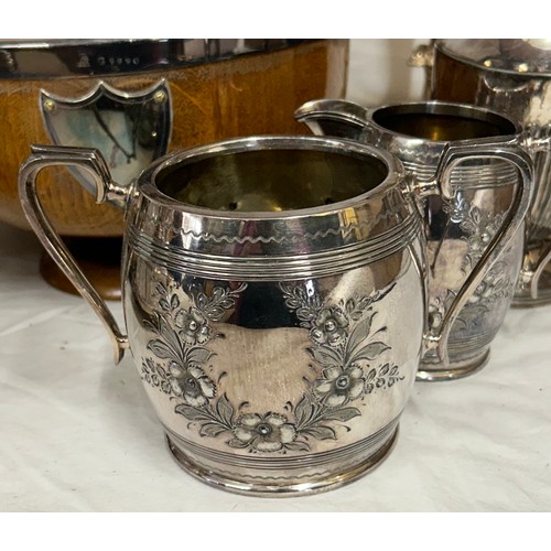 748 - A quantity of silver plated items to include a pair of candlesticks, 2 x coffee pots, teapot, sugar,... 