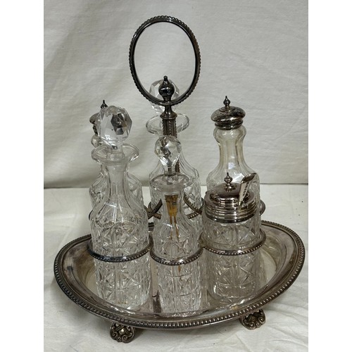 748 - A quantity of silver plated items to include a pair of candlesticks, 2 x coffee pots, teapot, sugar,... 