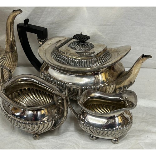 748 - A quantity of silver plated items to include a pair of candlesticks, 2 x coffee pots, teapot, sugar,... 