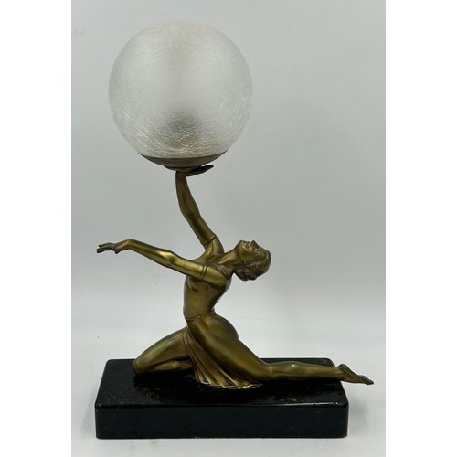 1012 - An Art Deco style figural table lamp, modelled in the form of a lady atop a marble type base. 47cm t... 